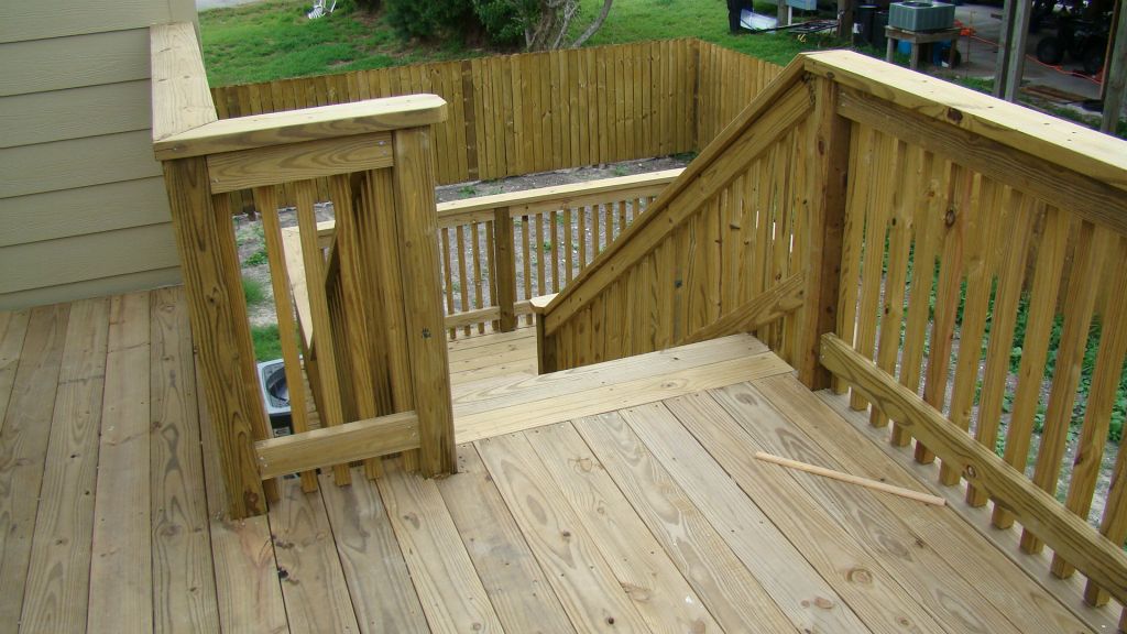 ELEVATED WOOD DECK with HANDRAILS at BACK YARD